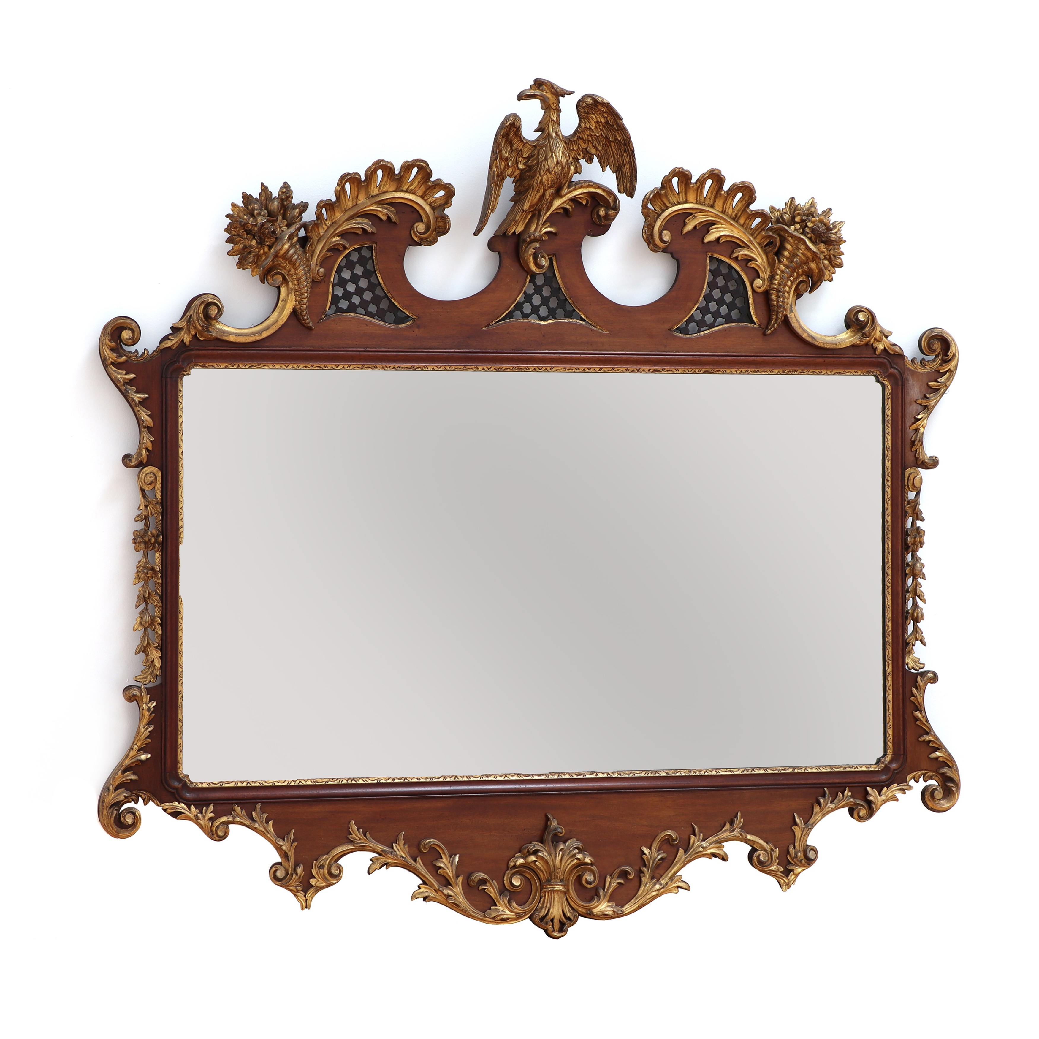 A large George II-style mahogany and parcel-gilt mirror